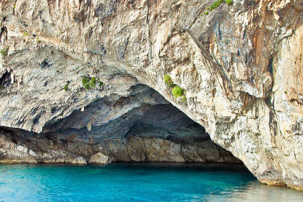 The impressive entrance to the historic Papanikolis sea cave on Meganisi island.